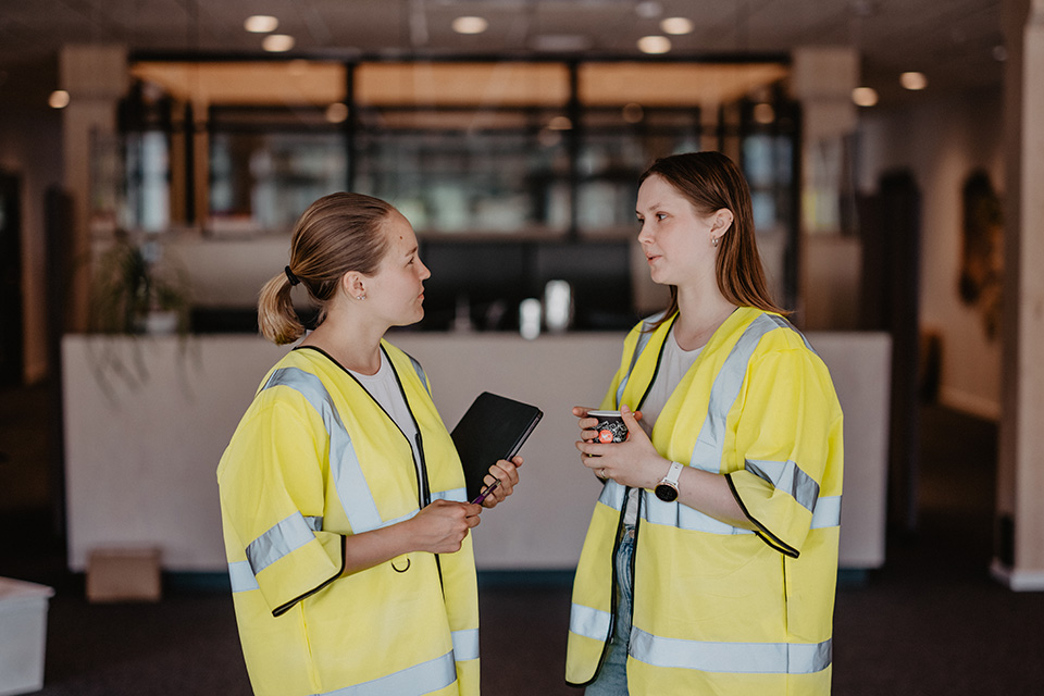 Two female workers having a conversation